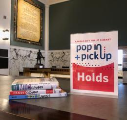 Photo of a sign reading "Pop In Pickup Holds"
