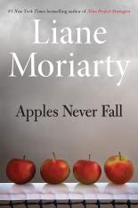 The cover of Apples Never Fall has a grey, smoky background with 4 apples on a table at the bottom of the cover