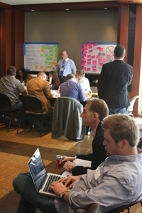 Joe Cox (lower right) and Mike Brown watch as community leaders brainstorm ideas for Google Fiber. Gigabit City