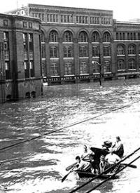 View of unidentified men in flatboat near the foot of the 12th Street Viaduct at 12th and Liberty during 1951 flood. (<a href="/sites/default/files/flood_photos3.jpg" target="_blank"><em>Full Image</em></a>) The 1951 Flood