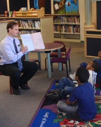 Nick Holmes reads to kids at the Southeast Branch.