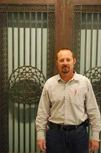 Jerry Houchins helped turn these former bank gates into a decorative piece for the Central Library.