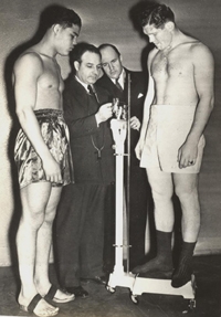 Caption: Joe Louis (left) and Natie Brown weigh in. Kansas City, 1937. (Photo: American Jewish Historical Society) Joe Louis and Natie Brown