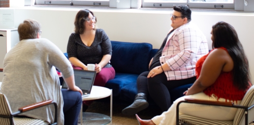 Group of four having a discussion