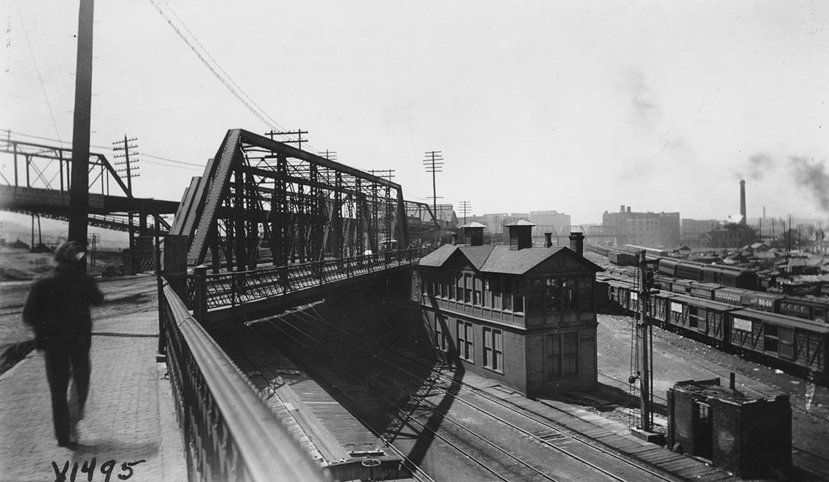 A pedestrian preparing to cross the Bluff Street Bridge into the West Bottoms, 1894