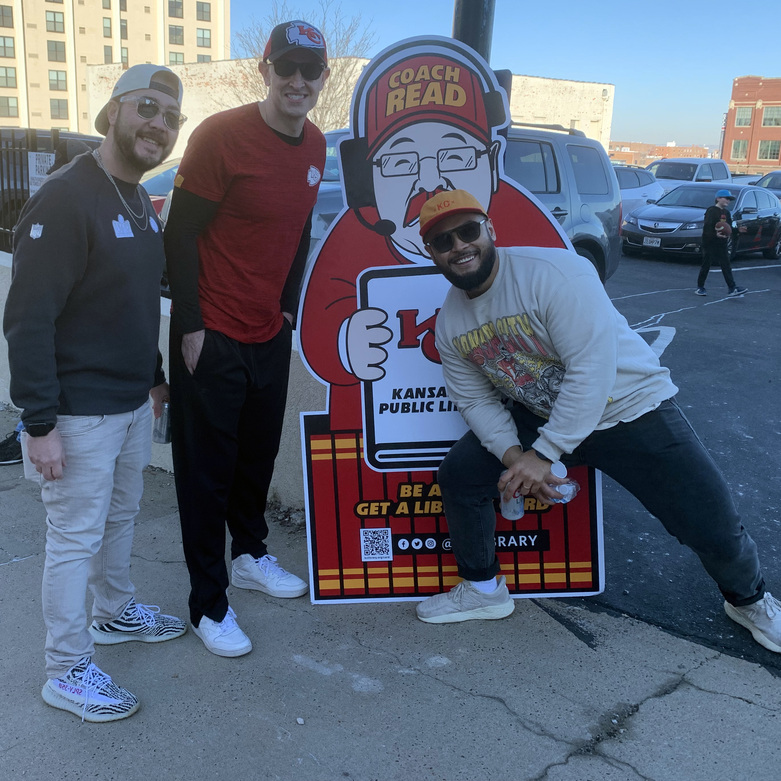 group of 3 men by cardboard cutout