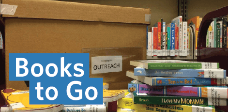 cardboard box with stack of books