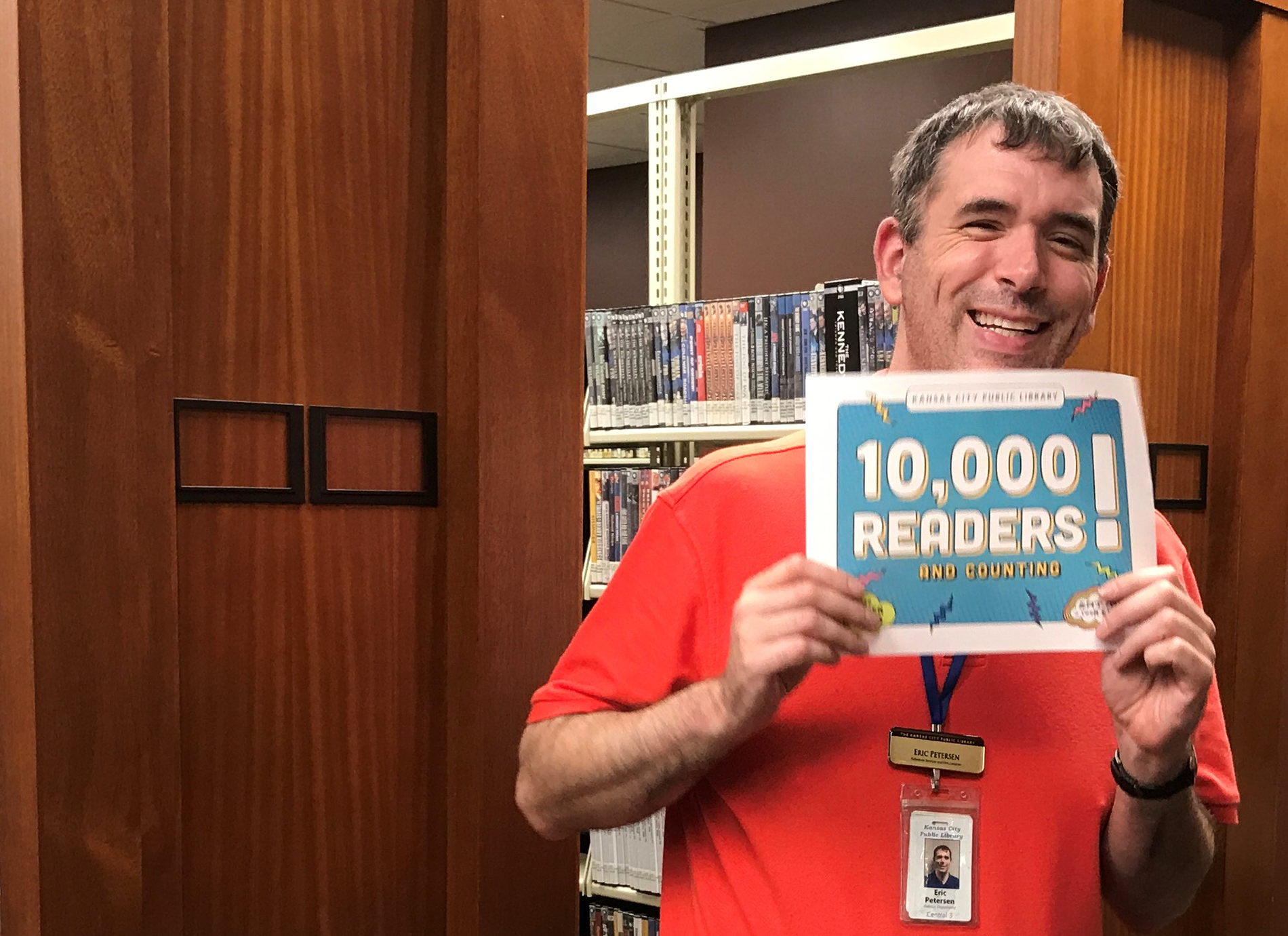 library staff member with sign