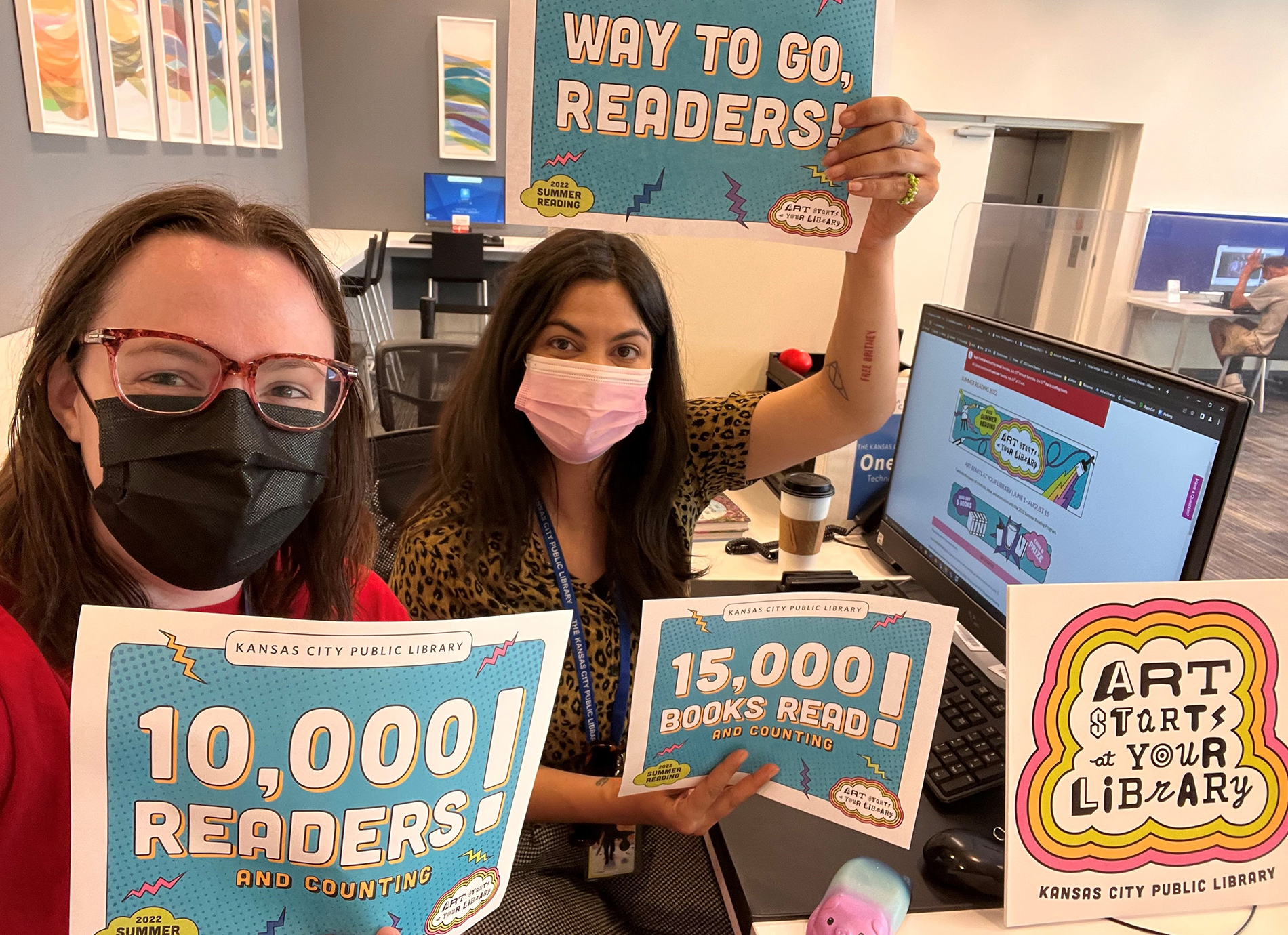 library staff members with signs