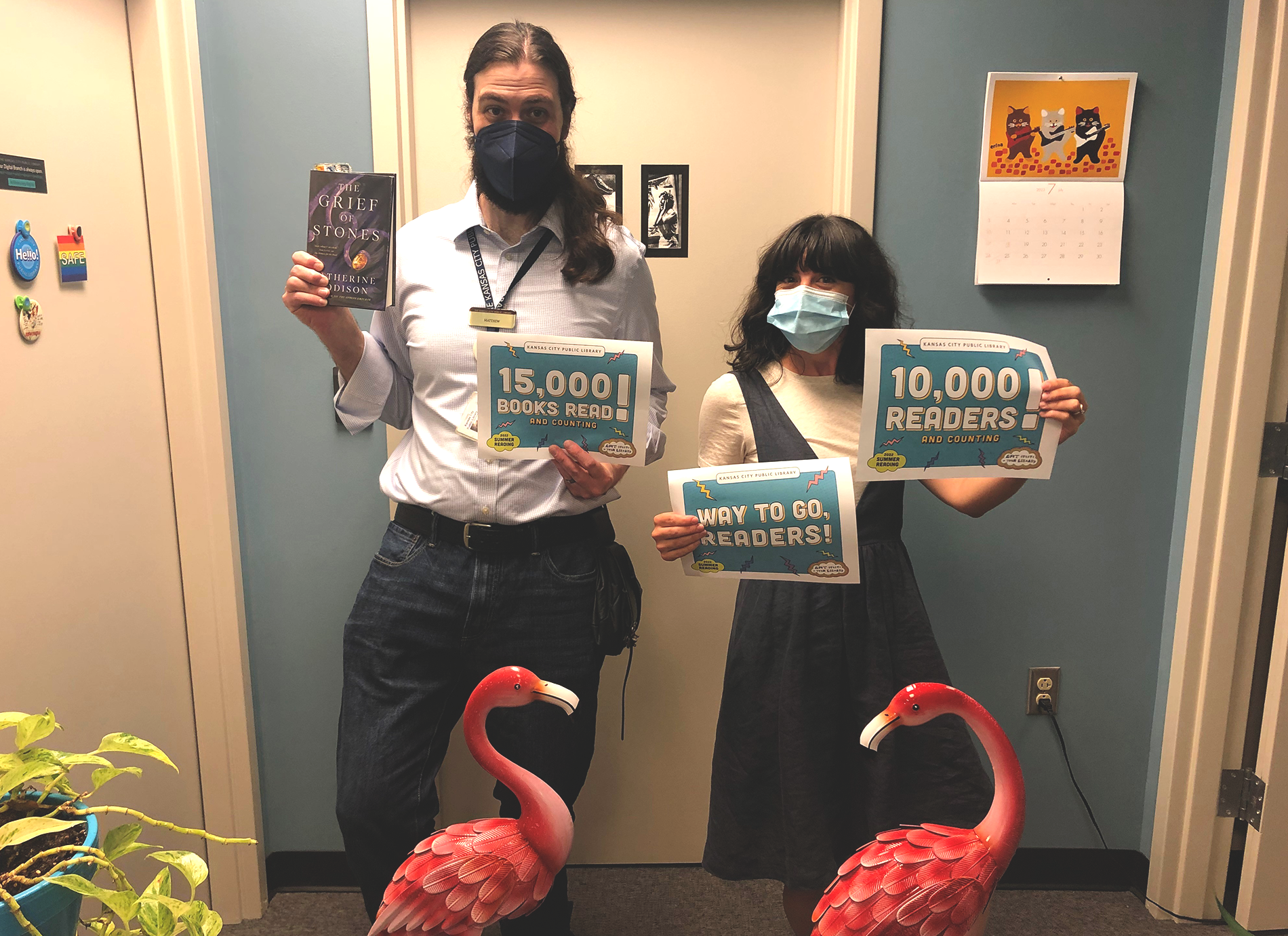 library staff members with signs