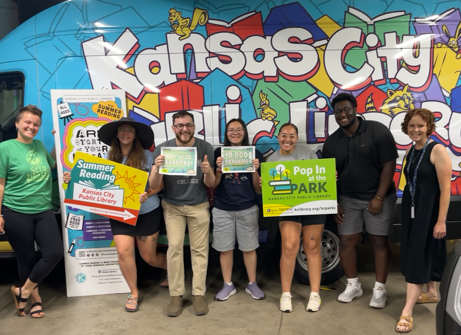 library staff members with signs