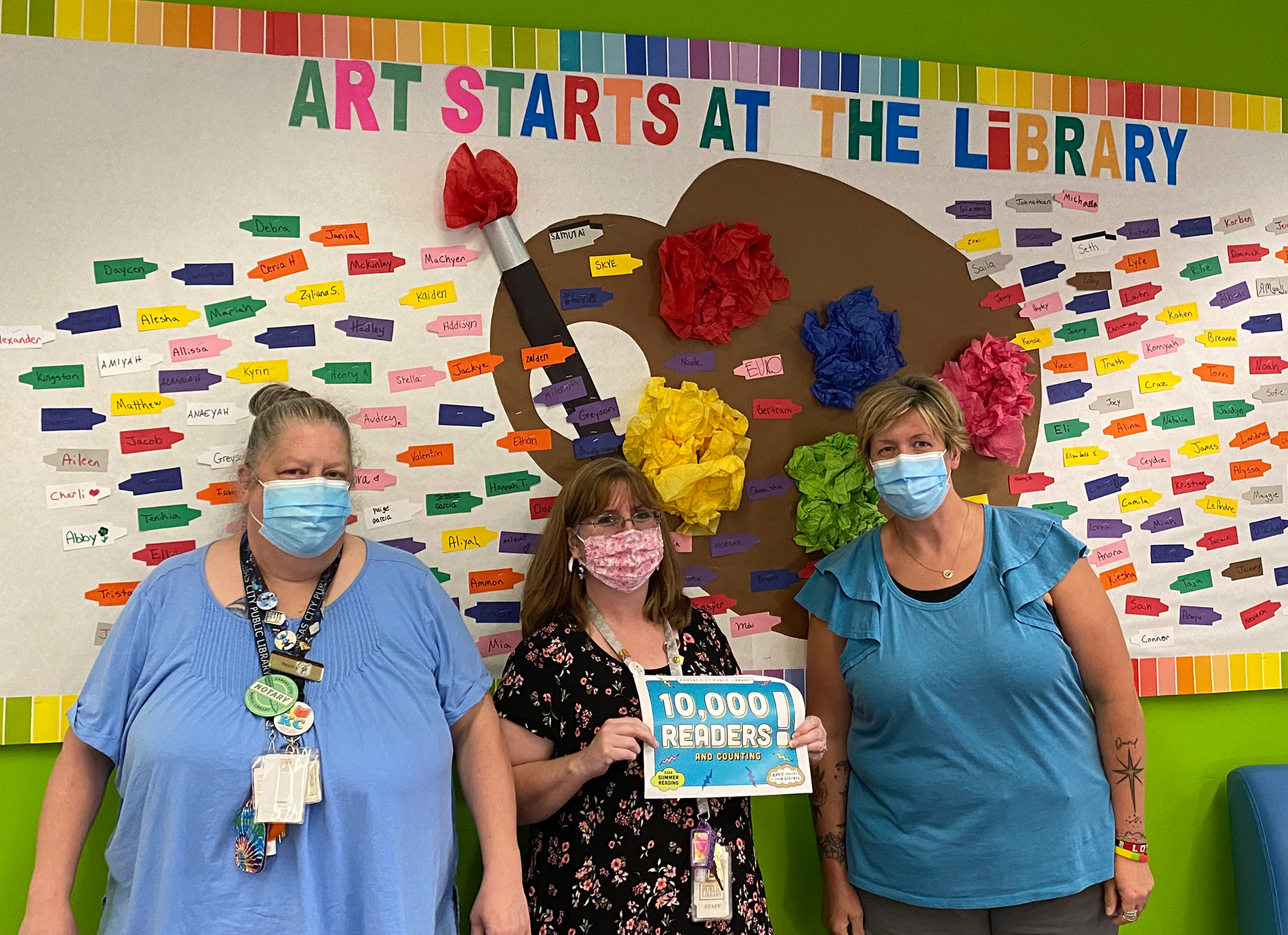 library staff members with signs