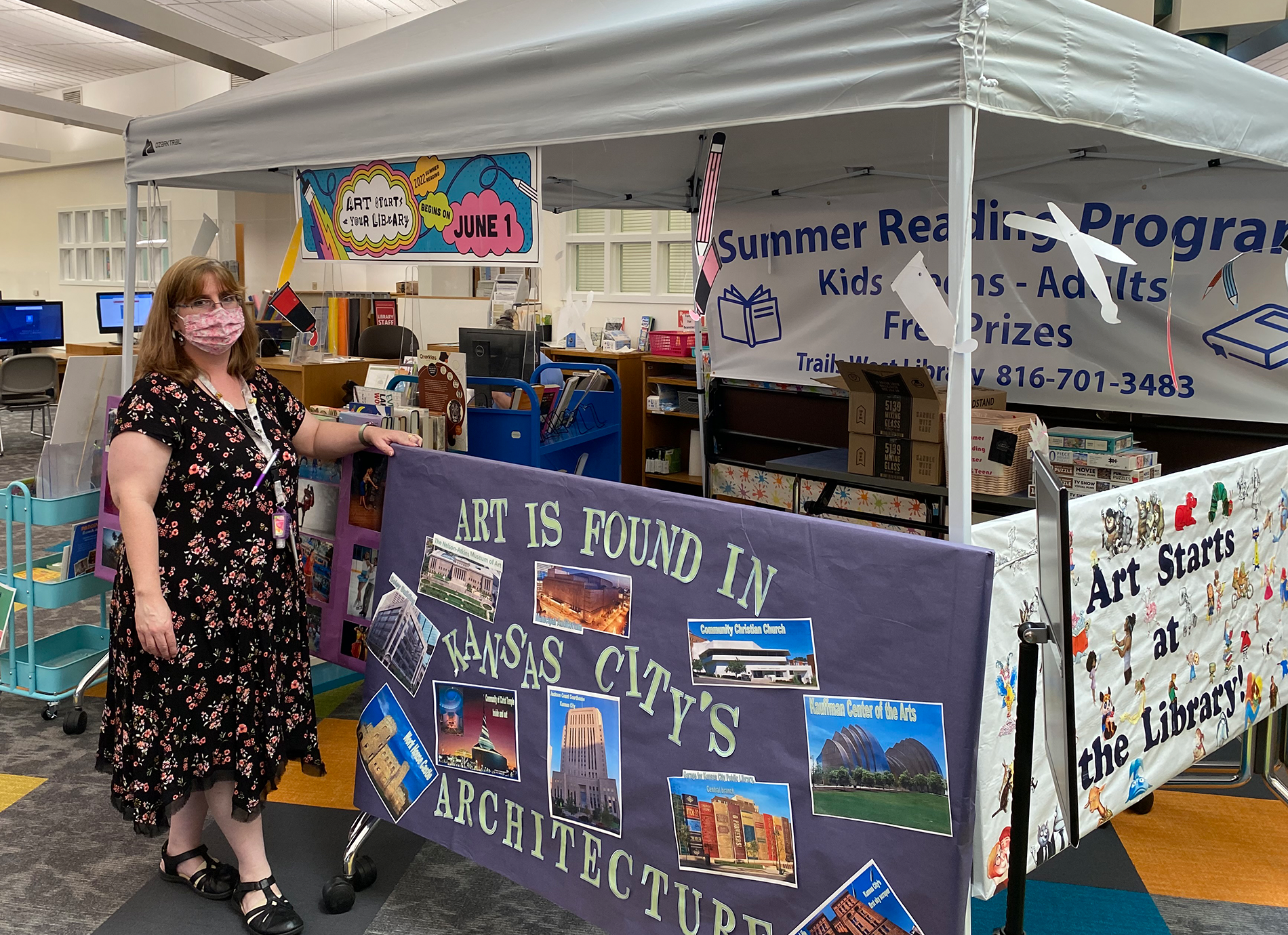 library staff member with sign