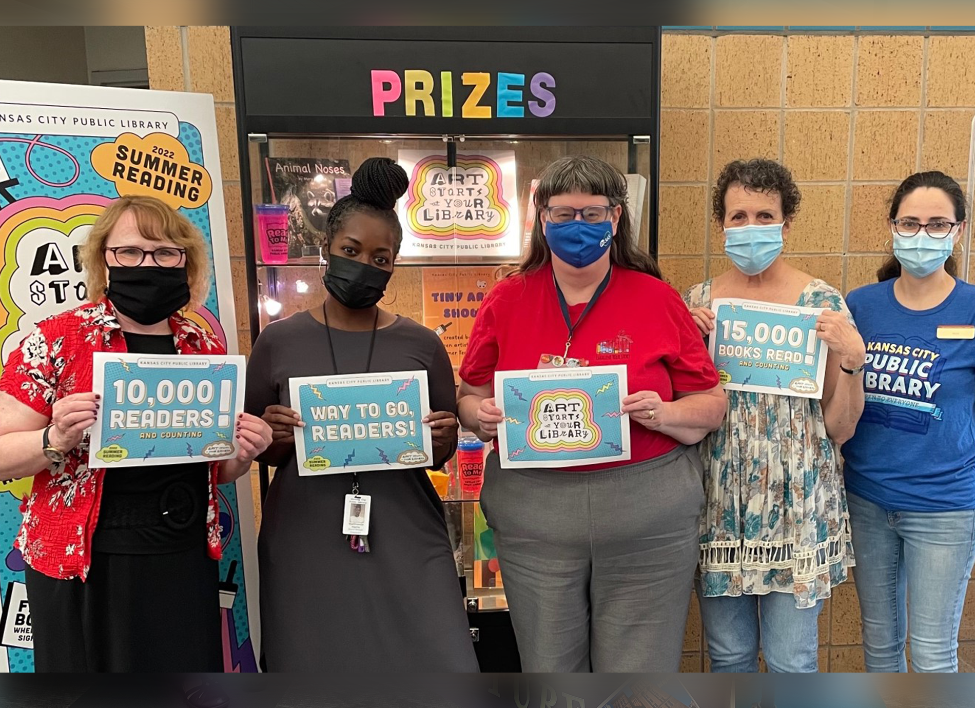 library staff members with signs