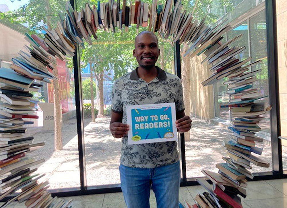 library staff member with sign