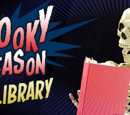 Skeleton reading a book