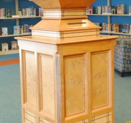 Child Reading on Pedestal