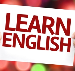 hands holding paper with words "Learn English"