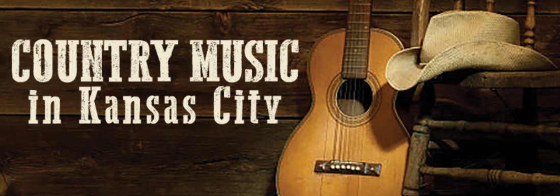 guitar leans against chair with hat