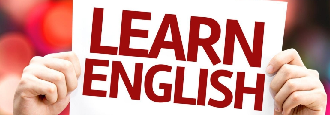 hands holding paper with words "Learn English"