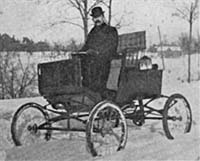 The steam that powered this "locomobile" also kept its driver warm. Locomobile