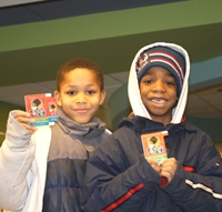 ZaiTavian Kerr (9, left) and his brother Amaureion (8) show off their new Library cards. ZaiTavian and Amaureion Kerr