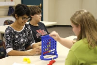 Trails West Technical Assistant Amanda Barnhart (left) doesn't always let the teens win.