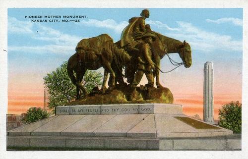 Color postcard of a statue of a women on horseback viewed in profile with one man visible leading the horse